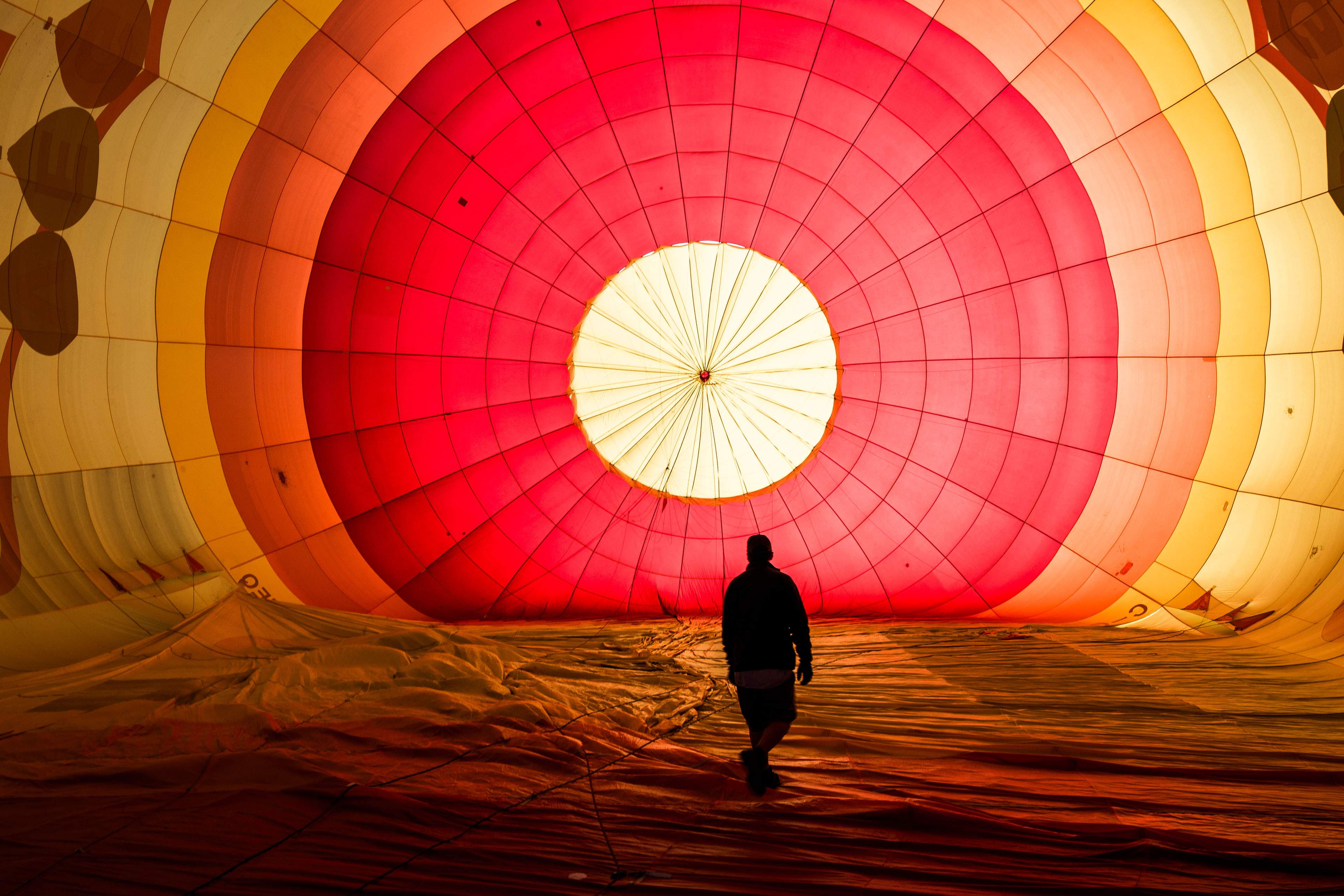 A man walk in the balloon in sunrise