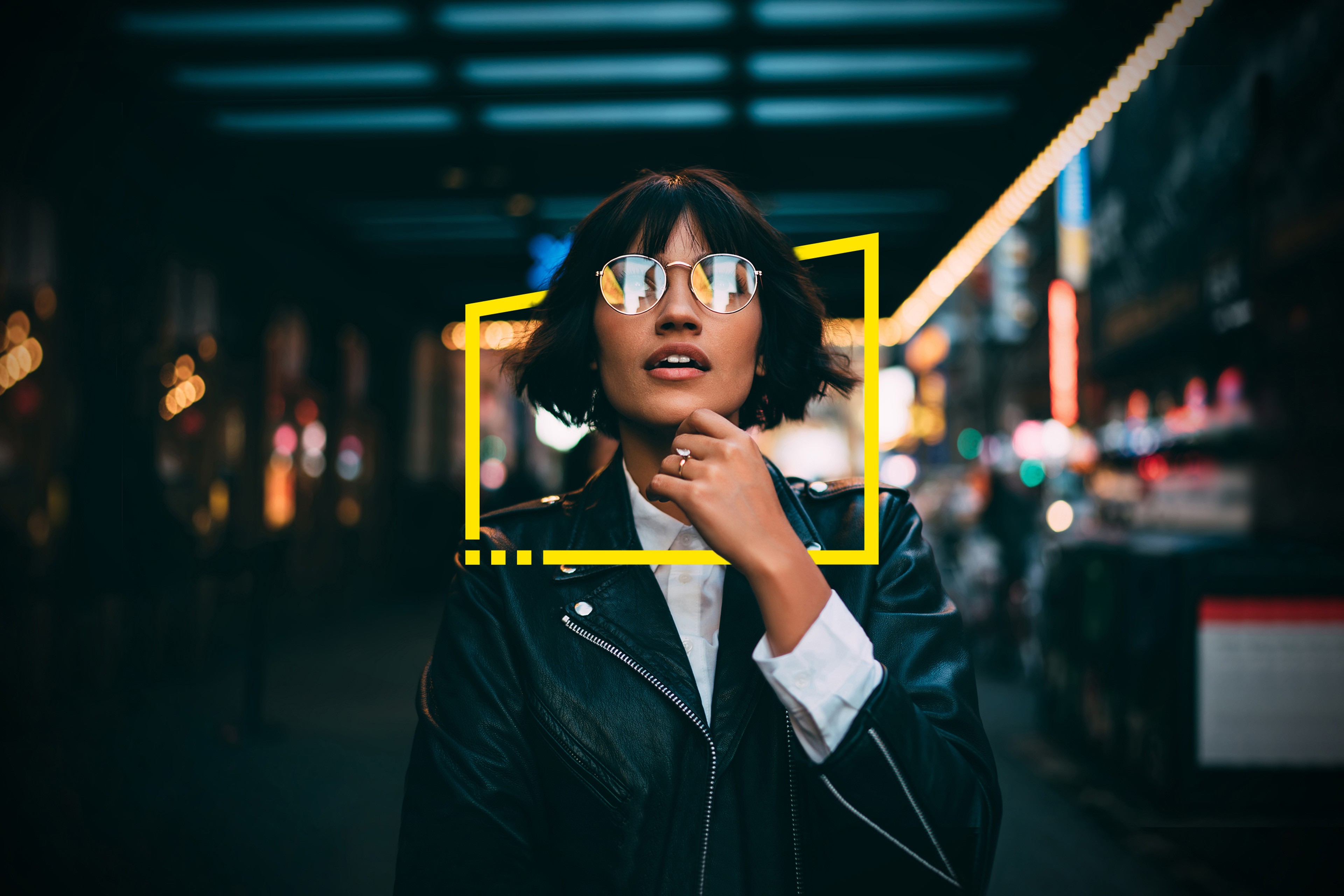 Woman at night in city looking light reflection