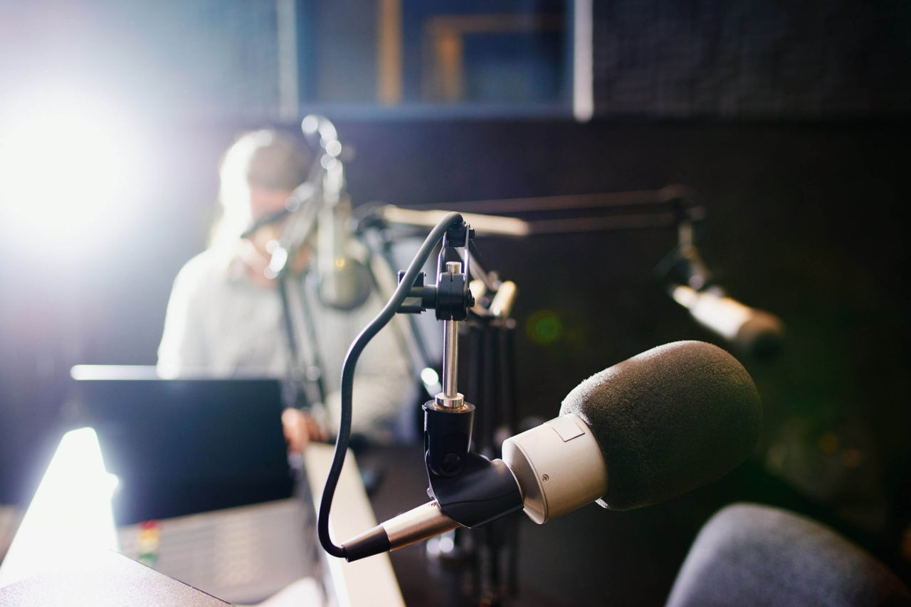 Person working on Laptop in podcast studio